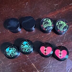4 Sets of Black Plastic Plugs with Unique Designs: 1/2” (12mm)